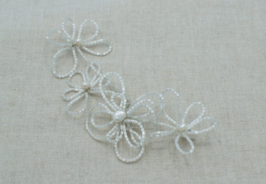 Tocado de canutillos en forma de flores